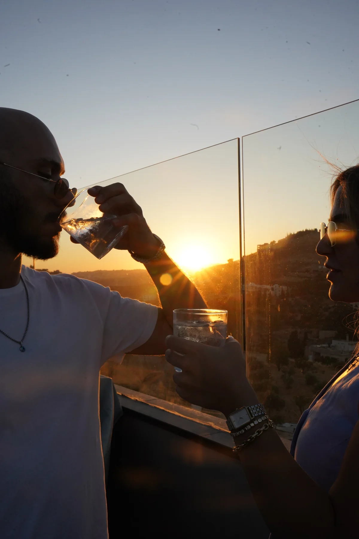 Guests enjoying drinks at sunset at NYX Rooftop in Fuheis